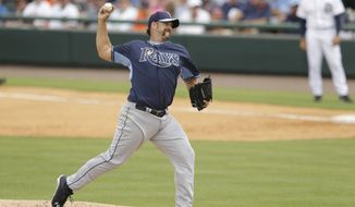 Tampa Bay Rays relief pitcher Heath Bell throws during the fifth inning of a spring exhibition baseball game against the Detroit Tigers in Lakeland, Fla., Friday, March 28, 2014. (AP Photo/Carlos Osorio)