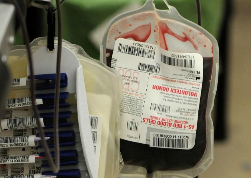 Blood is collected in St. Cloud Minn., March 19, 2014. (Associated Press) ** FILE **