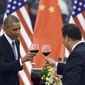 President Barack Obama, left, toasts with Chinese President Xi Jinping on Nov. 12 at a lunch banquet in the Great Hall of the People in Beijing. China has become one of the world&#39;s largest two economies, and is wealthy enough to buy up at least $1.3 trillion of the U.S. debt. But that hasn&#39;t stopped Uncle Sam from continuing to send foreign aid to Beijing. (Associated Press)