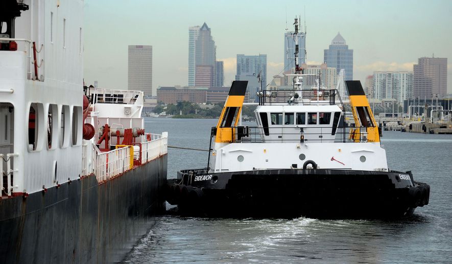 A tug boat guides a ship into Port Tampa Bay with the Tampa Skyline in the background on Jan 20, 2015 in Tampa, Fla. Port Tampa Bay experienced a 17 percent increase in ships coming in during 2014 and is marketing to grow its business domestically and internationally. (AP Photo/The Tampa Tribune, Jim Reed) ST. PETERSBURG OUT; LAKELAND OUT; BRADENTON OUT; MAGS OUT; LOCAL TELEVISION OUT; WTSP CH 10 OUT; WFTS CH 28 OUT; WTVT CH 13 OUT; BAYNEWS 9 OUT; THE TAMPA BAY TIMES OUT; LAKELAND LEDGER OUT; BRADENTON HERALD OUT; SARASOTA HERALD-TRIBUNE OUT; WINTER HAVEN NEWS CHIEF OUT