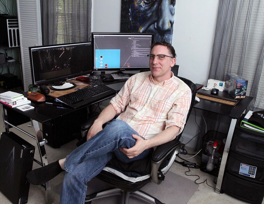 In a Oct. 30, 2014 photo, visual effects artist Brad Kalinoski works from his office and home in Wilson, N.C. (AP Photo/The Daily Times, Gray Whitley)