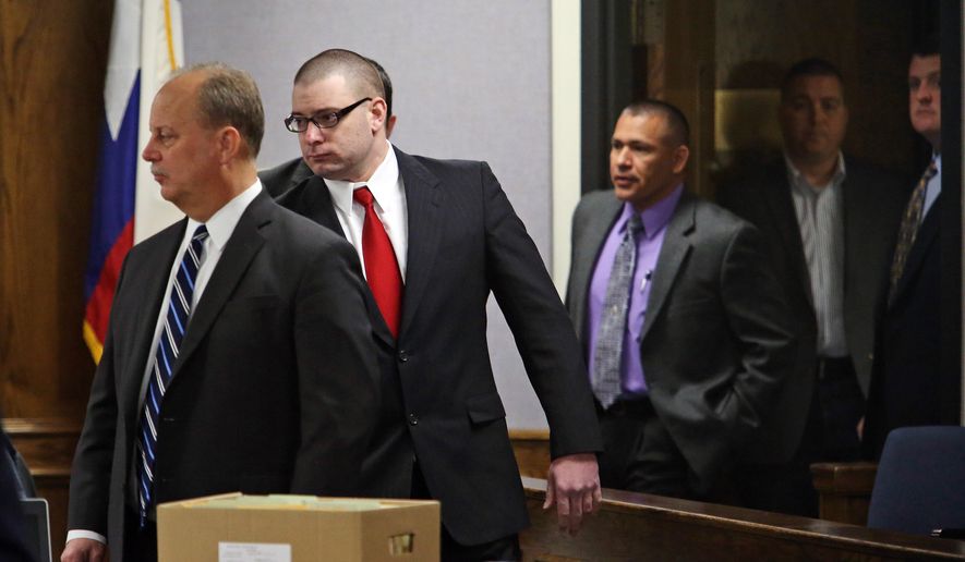 Former Marine Cpl. Eddie Ray Routh, second from left, enters the courtroom after a short mid-morning break for jurors during his capital murder trial at the Erath County, Donald R. Jones Justice Center in Stephenville, Texas, Friday, Feb. 13, 2015. Routh, 27, of Lancaster, is charged with the 2013 deaths of former Navy SEAL Chris Kyle and his friend Chad Littlefield at a shooting range near Glen Rose, Texas.  (AP Photo/The Fort Worth Star-Telegram, Paul Moseley, Pool)