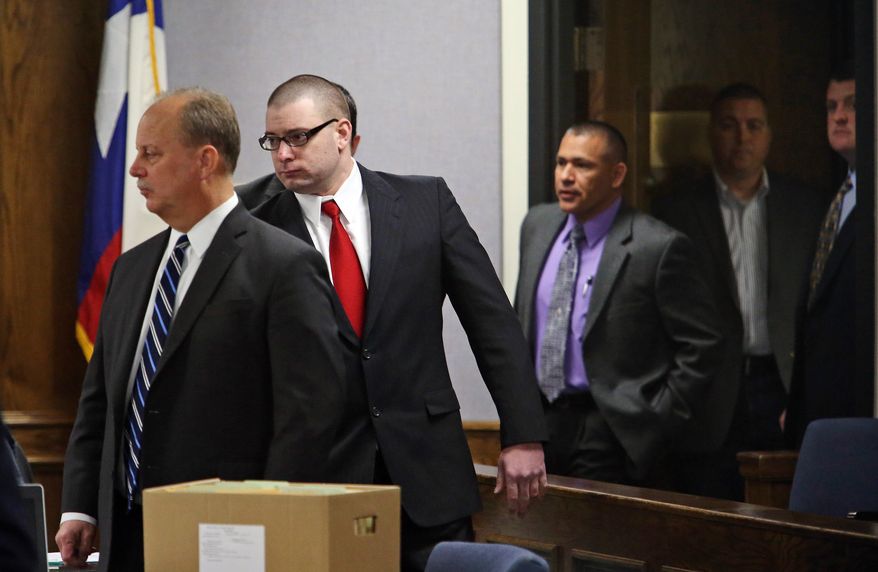 Former Marine Cpl. Eddie Ray Routh, second from left, enters the courtroom after a short mid-morning break for jurors during his capital murder trial at the Erath County, Donald R. Jones Justice Center in Stephenville, Texas, Friday, Feb. 13, 2015. Routh, 27, of Lancaster, is charged with the 2013 deaths of former Navy SEAL Chris Kyle and his friend Chad Littlefield at a shooting range near Glen Rose, Texas.  (AP Photo/The Fort Worth Star-Telegram, Paul Moseley, Pool)