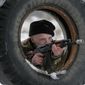 A newly mobilized Ukrainian soldier shows his skills during military drills in base Desna 100km north from Kiev, Ukraine, Friday, Feb. 13, 2015. Fierce fighting surged in East Ukraine as Russian-backed separatists mounted a major and sustained new push Friday to capture a strategic railway hub ahead of a weekend cease-fire deadline. (AP Photo/Efrem Lukatsky)