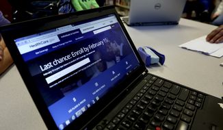 In this Thursday, Feb. 12, 2015 photo, a laptop shows the HealthCare.com web site during an Affordable Care Act enrollment event at the Fort Worth Public Library in Fort Worth, Texas. (Associated Press) ** FILE **
