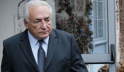 Former International Monetary Fund boss Dominique Strauss-Kahn leaves his hotel in Lille, northern France, Wednesday, Feb. 11, 2015, as he goes on trial for sex charges at a court. Strauss-Kahn sat nonchalantly with folded-arms and stretched legs Tuesday, before telling a French court he was completely unaware that women who participated in orgies at luxury hotels in Paris and Washington were prostitutes. (AP Photo/Christophe Ena)