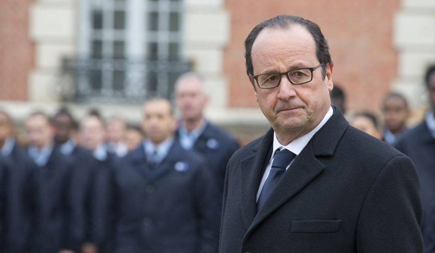 France&#x27;s President Francois Hollande salutes the French flag as part of his visit to a public center for insertion of the Defense (EPIDE) in Montry, northeastern Monday, Feb. 16, 2015. (AP Photo/Jacques Brinon/Pool)