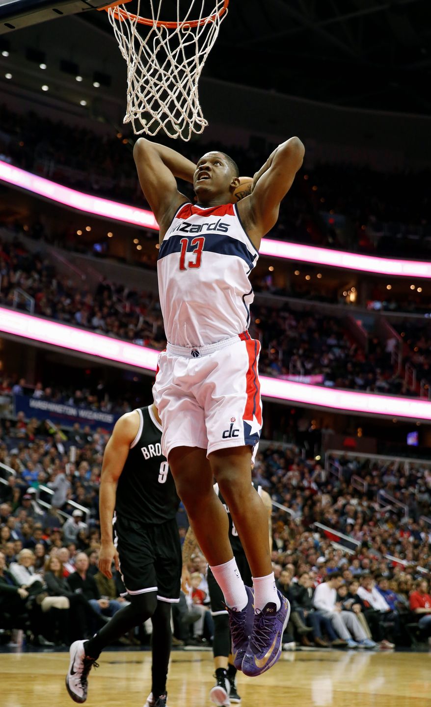 The offensive fluctuations of the Wizards' Rasual Butler (left) and Kevin Seraphin have been a microcosm of the bench's inconsistency this season. (Associated Press Photographs)