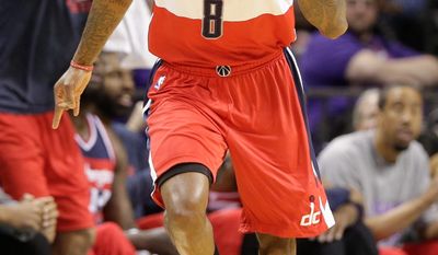 Washington Wizards&#x27; Rasual Butler (8) reacts after making a basket against the Charlotte Hornets during the first half of an NBA basketball game in Charlotte, N.C., Thursday, Feb. 5, 2015. (AP Photo/Chuck Burton)
Washington Wizards&#x27; Rasual Butler (8) reacts after making a basket against the Charlotte Hornets during the first half of an NBA basketball game in Charlotte, N.C., Thursday, Feb. 5, 2015. (AP Photo/Chuck Burton)