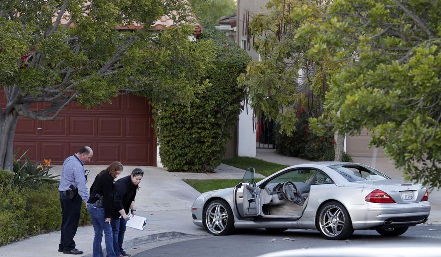 FILE - In this Tuesday, Feb. 10, 2015 file photo, police investigators examine the scene following a shooting in San Diego. CBS News 8 affiliate KFMB-TV says sports anchor Kyle Kraska was attacked Tuesday, Feb. 10, in the Scripps Ranch area of the city. A house painter is due to be arraigned Tuesday, Feb. 17, 2015, on a charge of attempted murder for allegedly shooting and wounding Kraska. Police say Mike Montana was in a business dispute over work done on the television personality's house. (AP Photo/Gregory Bull, File)