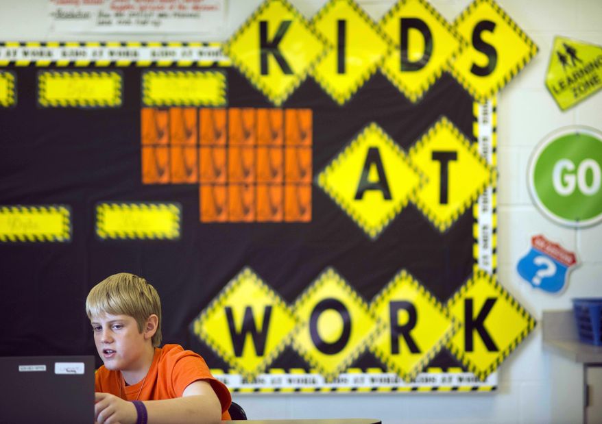 Sixth grader Alex Greuey, 11, reads through a problem in the English Language Arts section of the PARCC (Partnership for Assessment of Readiness for College and Careers). (AP Photo/Ty Wright)