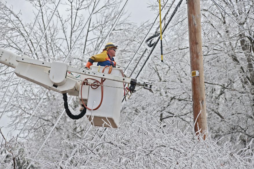 Jesse Stewart from Pike Electric prepares to work on high voltage lines on Browns Bridge Road in Gainesville, Ga., Tuesday, Feb. 17, 2015. About 200,000 Georgia households and businesses awoke this morning without power. Ice that blanketed north Georgia, including the top end of metro Atlanta, snapped trees and powerlines. (AP Photo/Atlanta Journal-Constitution, Bob Andres) MARIETTA DAILY OUT; GWINNETT DAILY POST OUT; LOCAL TELEVISION OUT; WXIA-TV OUT; WGCL-TV OUT