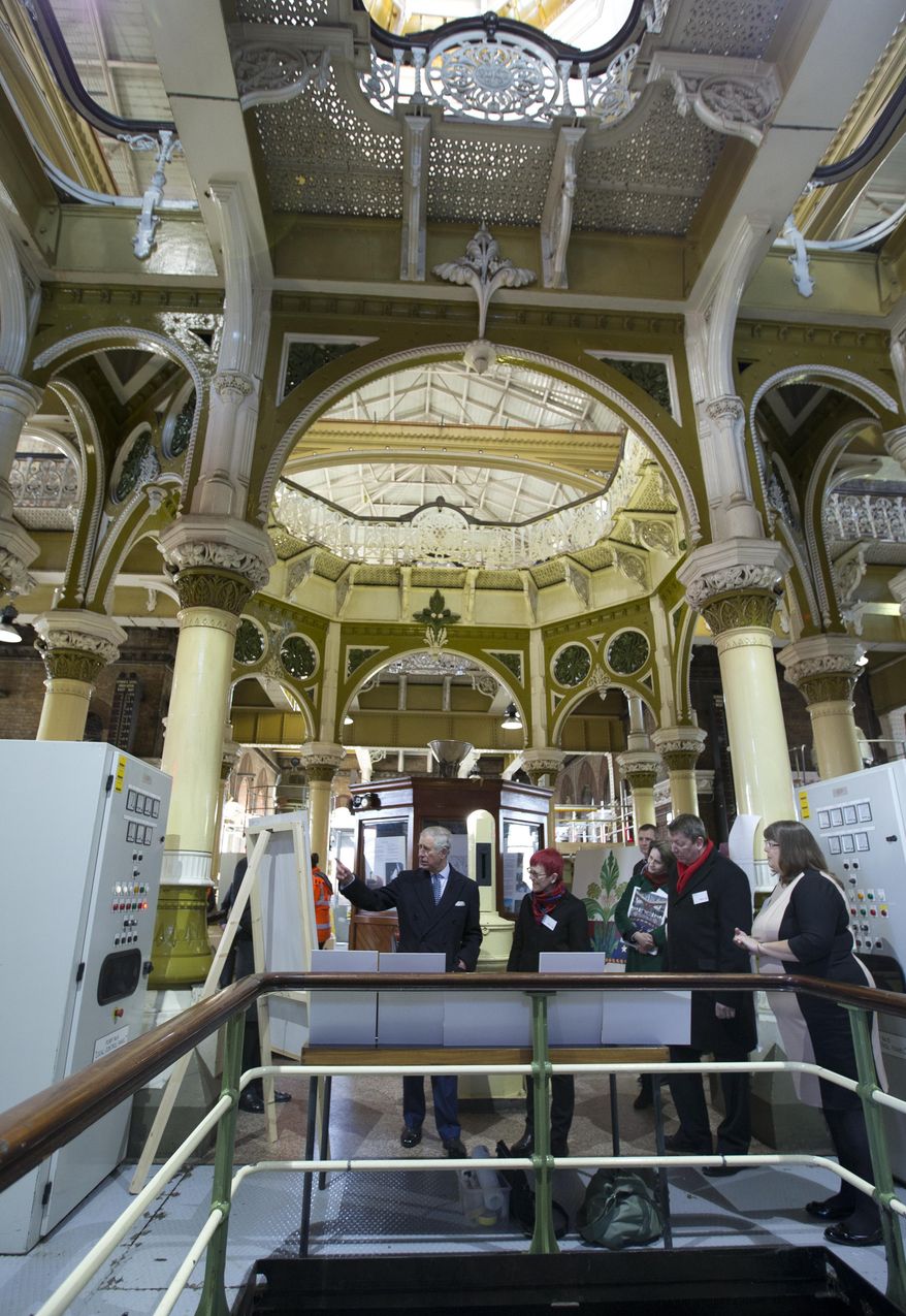 Britain&#39;s Prince Charles, left, is shown how reconstruction works is taking place during a visit to the Abbey Mills Pumping station London, Wednesday, Feb. 18, 2015. The Abbey Mills pumping station is one of the crown jewels of the Victorian sewage system that Joseph Bazalgette designed to help relive the chronic water and sewage problems London&#39;s growing population in 1865, and Prince Charles&#39;s visit is to commemorate the 150th anniversary of the start of the modern water system that serves London.(AP Photo/Alastair Grant, Pool)