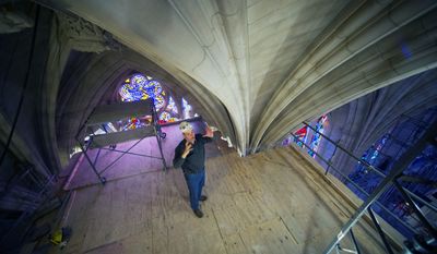 Head Mason Joe Alonso talks about repairs of the stonework at the Washington National Cathedral on scaffolding 65 feet above the nave floor. The Cathedral has finished the first phase of restoration work needed after an earthquake in 2011. (Associated Press photographs)