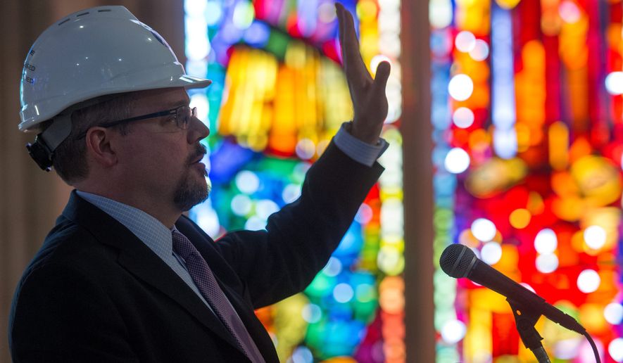 Washington National Cathedral Director of Preservation and Facilities Jim Shepherd talks about repairs and cleaning of the stonework in the ceiling at the Washington National Cathedral in Washington, Wednesday.