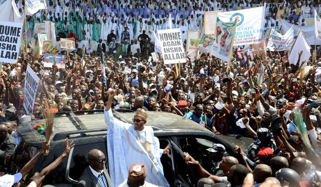 Nigerian presidential candidate Muhammadu Buhari from the All Progressives Congress party waves to his supporters in Maiduguri, Nigeria. Two of Nigeria&#x27;s top diplomats vowed that their nation&#x27;s postponed elections will occur March 28. (Associated Press)