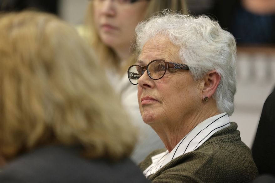 Former Washington state Sen. Debbie Regala, whose brother-in-law was murdered in 1980, listens to testimony, Wednesday, Feb. 18, 2015, during a hearing at the Capitol in Olympia, Wash., for House Bill 1739, which would abolish Washington state’s death penalty and replace it with life in prison, with no opportunity for parole. Regala spoke in favor of the bill, saying the death penalty is not a deterrent to murder, but that life in prison is. (AP Photo/Ted S. Warren)