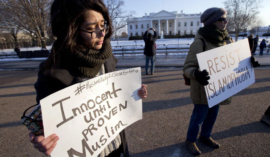 Muslim-American Mahroh Jahangiri, left, joins a group of protestors gathered in front of the White House, in Washington, Wednesday, Feb. 18, 2015, during a rally to bring awareness of how &amp;quot;Countering Violent Extremism&amp;quot; measures continue to erroneously single out Muslims.  (AP Photo/Manuel Balce Ceneta)