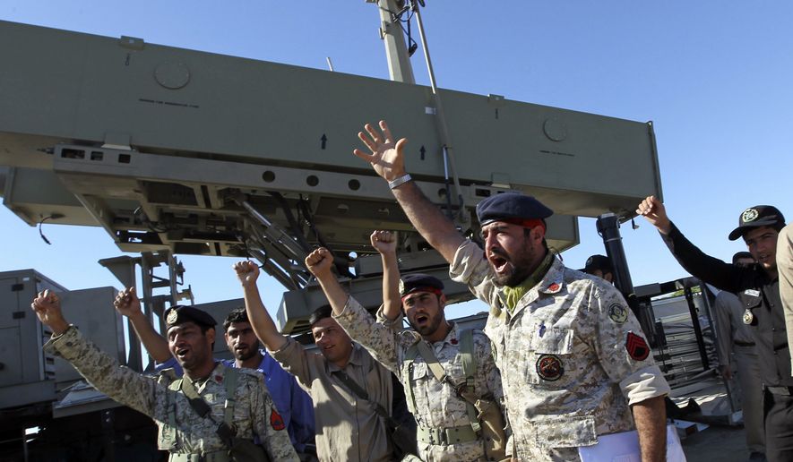 Iranian navy personnel celebrate after successfully launching a Ghader missile from the Jask port area on the shores of the Sea of Oman during a drill, Tuesday, Jan. 1, 2013. Iran says it has tested advanced anti-ship missiles in the final day of a naval drill near the strategic Strait of Hormuz, th(...)