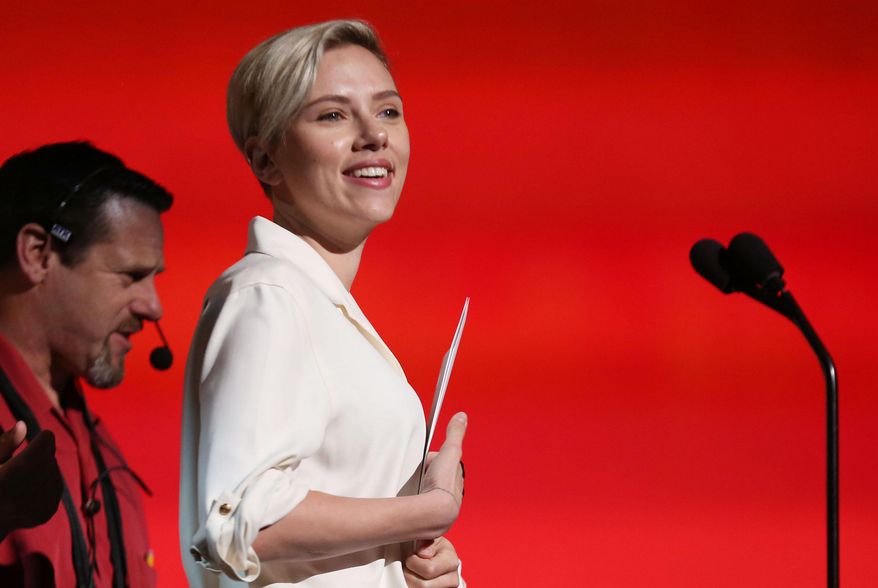 Actress Scarlett Johansson, right, is seen during rehearsals for the 87th Academy Awards in Los Angeles, Thursday, Feb. 19, 2015. The Academy Awards will be held at the Dolby Theatre on Sunday, Feb. 22. (Photo by Matt Sayles/Invision/AP)