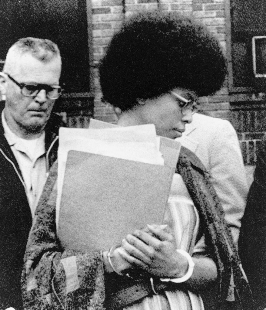 Joanne Chesimard, member of the Black Panther Party and Black Liberation Army, leaves Middlesex County courthouse in New Brunswick, N.J. on April 25, 1977. Now known as Assata Shakur, Chesimard was convicted in 1977 of killing a New Jersey state trooper four years earlier, and was sentenced to life in prison but escaped and wound up in Cuba in the 1980s where she continues to reside. (Associated Press) **FILE**