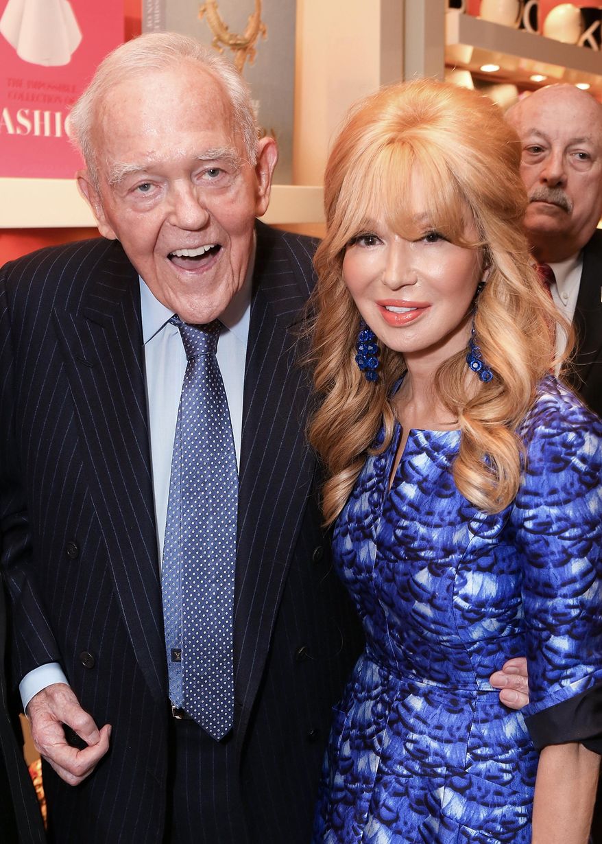 FILE - In this Oct. 10, 2013 file photo, Henry T. Segerstrom and his wife Elizabeth Segerstrom pose during the "Henry T. Segerstrom: The Courage of Imagination and the Development of the Arts in Southern California" book launch party at South Coast Plaza in Costa Mesa, Calif. Segerstrom, an Orange County developer who transformed his family's lima bean fields into the internationally renowned South Coast Plaza shopping center, has died at age 91. Segerstrom died Friday, Feb. 20, 2015 at his home in Newport Beach, Calif., after a brief illness, said his son-in-law David Grant. (AP Photo/Ryan Miller/Invision/AP, File)