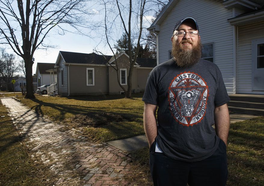 In this Jan. 20, 2015 photo, Chad Shanle poses for a photo in Petersburg, Ill. Shanle was driving home from work in Springfield on Jan. 10 and was the first person to arrive at the scene of a head-on crash near Cantrall. He pulled 19-year-old Kayla Thompson from her car before it became engulfed in flames. (AP Photo/The State Journal-Register, Ted Schurter)