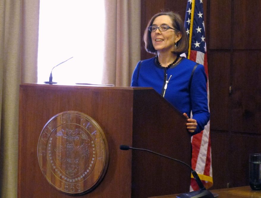 Oregon Gov. Kate Brown speaks to reporters at the state Capitol in Salem, Oregon on Friday, Feb. 20, 2015. In her first press conference since she became governor this week, Brown said she’d continue her predecessor’s moratorium on the death penalty. (AP Photo/Jonathan J. Cooper)