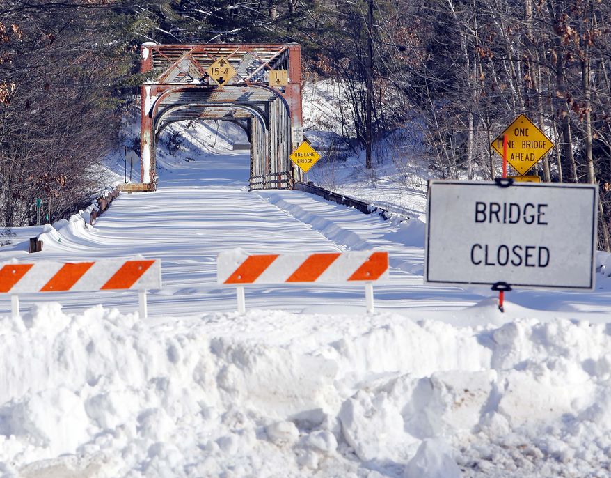 In this photo taken Wednesday, Feb. 11, 2015, the Sewalls Falls bridge over the Merrimack River is seen closed in Concord, N.H. Federal Highway Trust Fund spending in New Hampshire fell by nearly 5 percent from 2008-2013, a decline that elected and transportation officials say puts the state's roads and bridges in jeopardy. (AP Photo/Jim Cole)