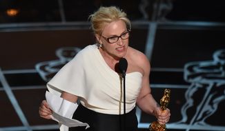 Patricia Arquette accepts the award for best actress in a supporting role for “Boyhood” at the Oscars on Sunday, Feb. 22, 2015, at the Dolby Theatre in Los Angeles. (Photo by John Shearer/Invision/AP)