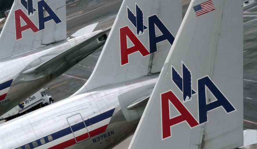 American Airlines airplanes are parked at their gates at JFK International airport in New York.  (AP Photo/Mary Altaffer, File)