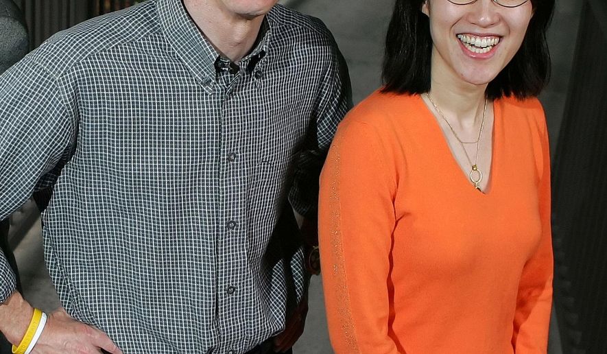 FILE - In this April 4, 2006 file photo, Kleiner Perkins Caulfield and Byers senior partner John Doerr poses for a portrait with partner Ellen Pao outside of their office in Menlo Park, Calif. A jury is set to hear opening arguments this week in a multimillion-dollar sexual harassment lawsuit filed by Pao, currently interim chief of the news and social media site Reddit, against the prominent Silicon Valley venture capital firm. (AP Photo/Marcio Jose Sanchez, File)