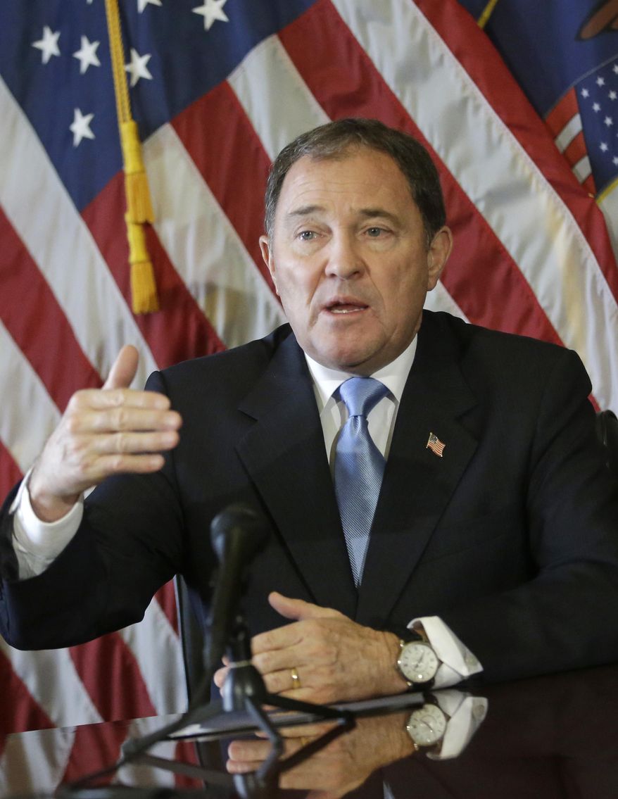 In this Feb. 5, 2015 photo, Utah Gov. Gary Herbert speaks to the reporters during a news conference at the Utah State Capitol, in Salt Lake City. Herbert says state lawmakers should back off efforts to change Utah's liquor laws this year, including a proposal to repeal a requirement that some restaurants mix and prepare drinks out of customers' view. Herbert, a Republican, told reporters Tuesday, Feb. 24, 2015 that Utah's alcohol policies appear to be working and he doesn't see a need for a change. (AP Photo/Rick Bowmer)