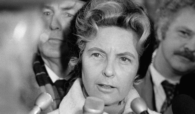 Phyllis Schlafly of Alton, Ill., in Chicago on Wednesday, Dec. 7, 1977, says that she won?t seek the U.S. Senate seat held by Charles H. Percy, also a Republican, in the March 21 primary. Mrs. Schlafly, allied with several conservative causes, conducted the press conference outdoors in Chicago?s subfreezing weather. (AP Photo)