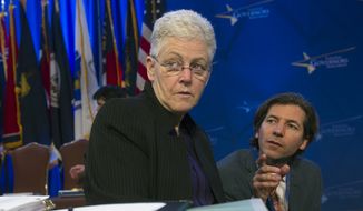 Environmental Protection Agency (EPA) Administrator Gina McCarthy confers with an aide as she prepares to address the Natural Resources Committee session during the National Governors Association Winter Meeting in Washington, Sunday, Feb. 22, 2015. (AP Photo/Cliff Owen) ** FILE **