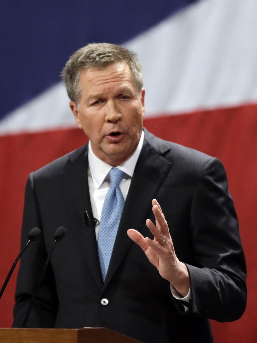 FILE-This Monday, Feb. 24, 2014 file photo shows Ohio Gov. John Kasich delivering his State of the State address at the Performing Arts Center in Medina, Ohio. The practical and political will share the stage on Tuesday as Kasich delivers his annual State of the State address in Wilmington, Ohio. As the first order of business, the Republican governor needs to appeal to state lawmakers gathered for the speech to support major policy changes on education, tax policy and social programs that he’s proposed in the 2-year state operating budget that’s moving through the Statehouse. As a potential 2016 presidential contender, he also is expected to touch on sweeping national themes. (AP Photo/Tony Dejak, File)