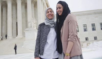 Samantha Elauf, right, with her mother Majda Elauf stand outside the Supreme Court in Washington, Wednesday, Feb. 25, 2015. The Supreme Court is indicating it will side with a Muslim woman who didn't get hired by clothing retailer Abercrombie & Fitch because she wore a black headscarf that conflicted with the company's dress code to her job interview. Liberal and conservative justices aggressively questioned the company's lawyer during arguments at the high court Wednesday in a case that deals with when an employer must take steps to accommodate the religious beliefs of a job applicant or worker.  (AP Photo/Pablo Martinez Monsivais)