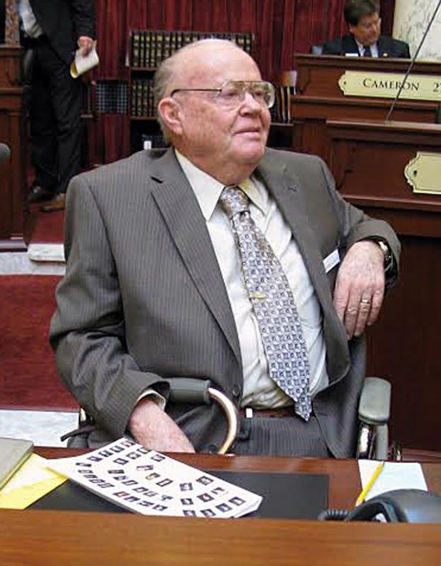 FILE - In this 2013, file photo, Quane Kenyon serves as a substitute state senator in Boise, Idaho. Kenyon, a retired Associated Press newsman who covered Idaho politics for 25 years, died of a heart attack at a Boise hospital on Tuesday, Feb. 24, 2015. He was 76. (AP Photo/The Spokesman-Review, Betsy Z. Russell, File) COEUR D’ALENE PRESS OUT