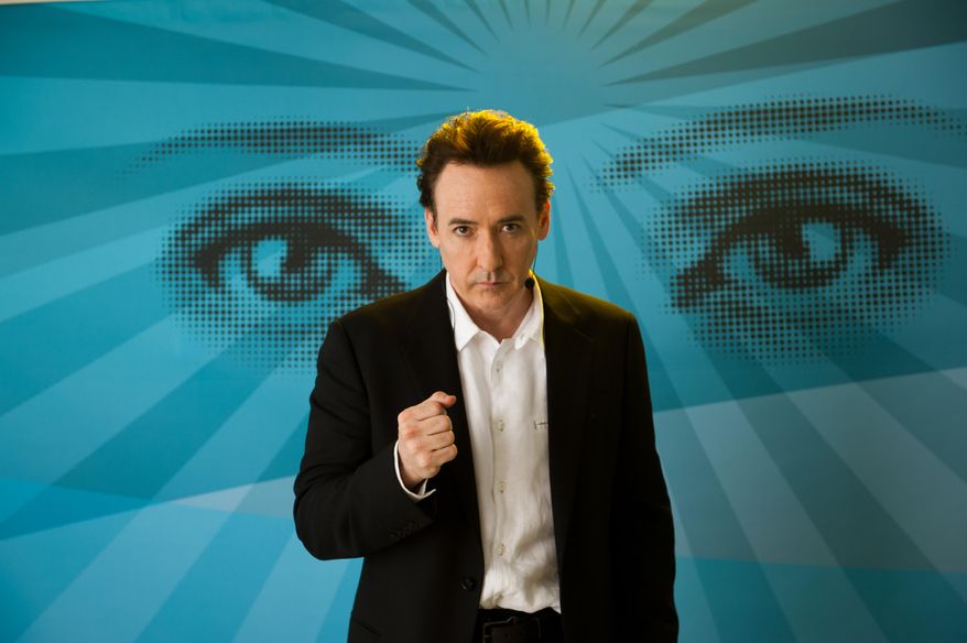 John Cusack appears in a scene from &quot;Maps to the Stars.&quot; (AP Photo/Focus World, Caitlin Cronenberg)  ** FILE **