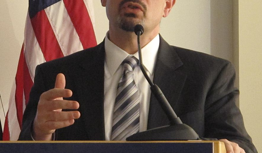 FILE - In this Feb. 2, 2015, file photo, State Medicaid director John McCarthy reviews details of a proposal to continue Medicaid expansion as part of Ohio Gov. John Kasich's two-year budget, in Columbus, Ohio. McCarthy said Thursday, Feb, 26, 2015, roughly 61,000 residents on the federal-state health program are poised to lose their coverage at the end of the week. (AP Photo/Andrew Welsh-Huggins, File)