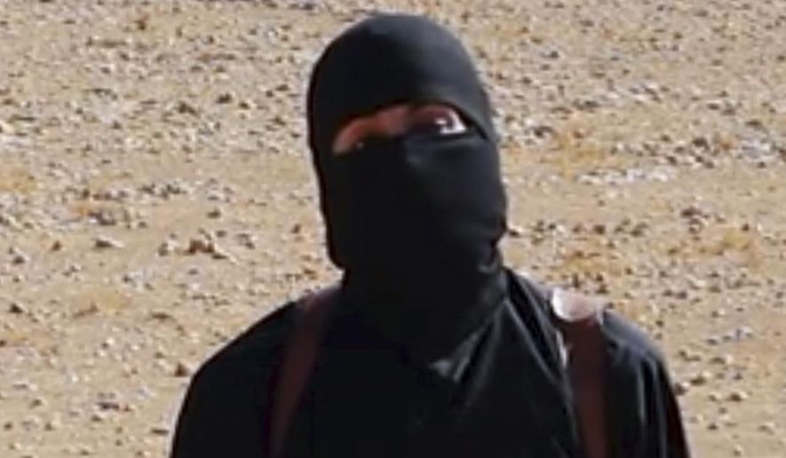 Mohammed Emwazi, the British member of the Islamic State group known as Jihadi John, appears in a beheading video released by the terrorist organization. (Associated Press) ** FILE **