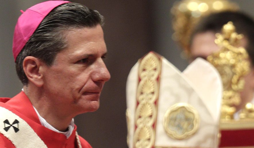 Gustavo Garcia Siller, archbishop of San Antonio, USA, leaves the altar after receiving the pallium from Pope Benedict XVI, a woolen shawl symbolizing his bond to the Pope, in St. Peter's Basilica at the Vatican, Wednesday, June 29, 2011. (AP Photo/Pier Paolo Cito)