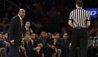 Georgetown head coach John Thompson III, left, argues a call with a referee during the first half of an NCAA college basketball game against St. John&#x27;s, Saturday, Feb. 28, 2015, at Madison Square Garden in New York.  (AP Photo/Mary Altaffer)