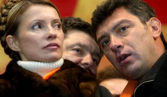 [u&quot;FILE - In this file photo taken on Monday Nov. 22, 2004, Boris Nemtsov, a leader of the Russian Union of liberal party, right, listens to Petro Poroshenko,  while Yulia Tymoshenko, left, looks on during a street protest   in downtown Kiev Ukraine. Russia&#39;s Interior Ministry says Boris Nemtsov, a leading opposition figure and former deputy prime minister, has been shot and killed near the Kremlin. Nemtsov, a sharp critic of President Vladimir Putin, was killed early Saturday. His death comes just a day before a major opposition rally in Moscow. (AP Photo/Efrem lukatsky)&quot;, u&#39;FILE - In this Nov. 22, 2004 file photo, Boris Nemtsov, a charismatic Russian opposition leader and sharp critic of President Vladimir Putin, right, listens to Petro Poroshenko while Yulia Tymoshenko, left, looks on during a street protest  in downtown Kiev Ukraine. Nemtsov was gunned down Saturday, Feb. 28, 2015 near the Kremlin, just a day before a planned protest against the government. (AP Photo/Efrem lukatsky)&#39;]