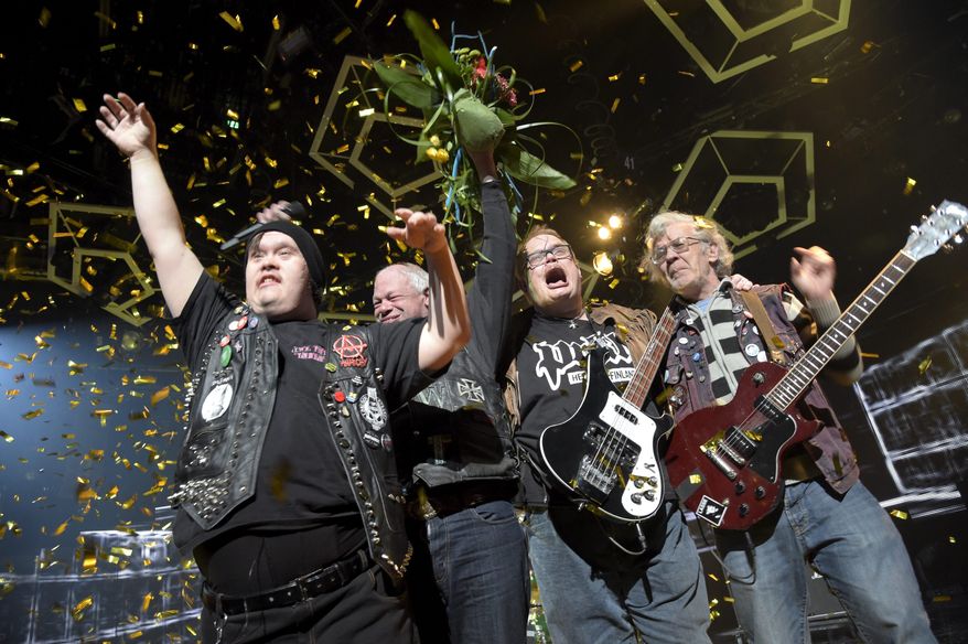 In this photo taken on Saturday, Feb. 28, 2015, punk band Pertti Kurikan Nimipäivät (PKN) celebrate after being selected to represent Finland's in the Eurovision song contest, during Yle's New Music Competition, in Helsinki. Four punk rockers with learning disabilities will compete for Finland in the Eurovision Song Contest semifinal after winning the Nordic country's national qualifying contest. The group Pertti Kurikan Nimipaivat, or PKN, was formed in 2009 at a workshop organized by an association that provides support for people with disabilities. The members have diagnoses such as autism and Down syndrome. (AP Photo/Lehtikuva, Markku Ulander) FINLAND OUT