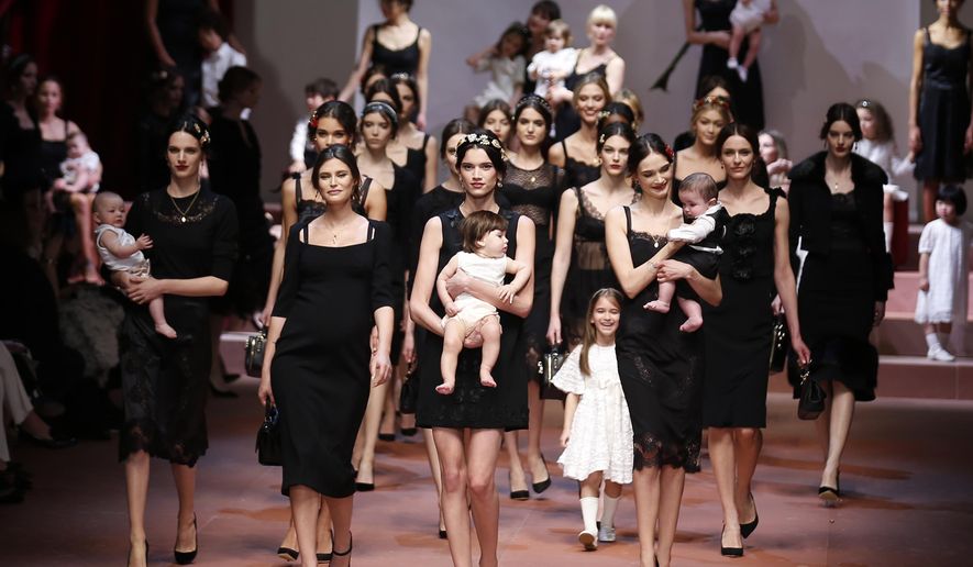 Models wear creations for Dolce & Gabbana women's Fall-Winter 2015-16 collection, part of the Milan Fashion Week, unveiled in Milan, Italy, Sunday, March 1, 2015. (AP Photo/Luca Bruno)