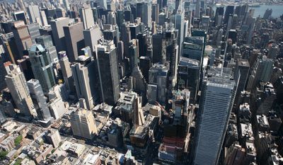 The New York Times building, lower right, and midtown Manhattan are shown in this aerial photo of Sept. 8, 2008 in New York. (AP Photo/Mark Lennihan)
