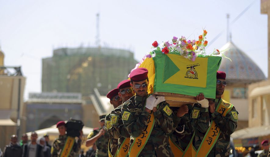 Iraqi Hezbollah fighters carry the coffin of their comrade, Ali Mansour, who his family says was killed in Tikrit fighting Islamic militants, during his funeral procession, in the Shiite holy city of Najaf, 100 miles (160 kilometers) south of Baghdad, Iraq, Monday, March 2, 2015. Backed by allied Shiite and Sunni fighters, Iraqi security forces on Monday began a large-scale military operation to recapture Saddam Hussein&#x27;s hometown from the Islamic State extremist group, state TV said, a major step in a campaign to reclaim a large swath of territory in northern Iraq controlled by the militants. (AP Photo/Jaber al-Helo)