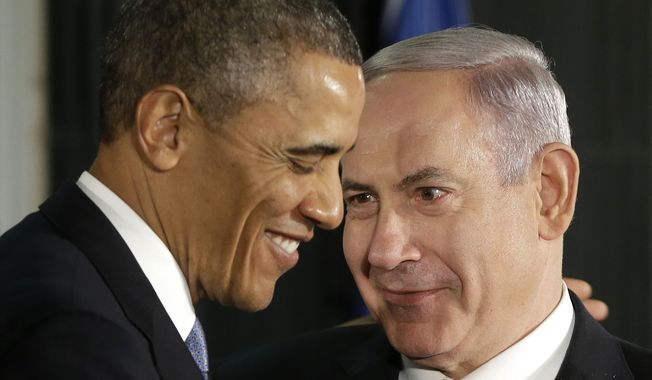 In this March 20, 2013, file photo, President Barack Obama and Israeli Prime Minister Benjamin Netanyahu huddle during their joint news conference in Jerusalem, Israel. (AP Photo/Pablo Martinez Monsivais, File) **FILE**