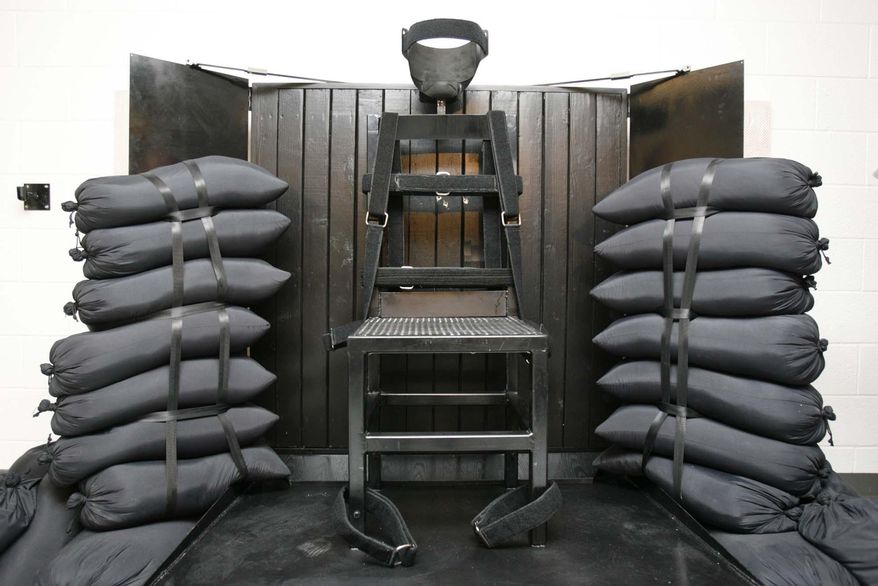 This June 18, 2010, file photo shows the firing squad execution chamber at the Utah State Prison in Draper, Utah. (AP Photo/Trent Nelson, Pool, File)